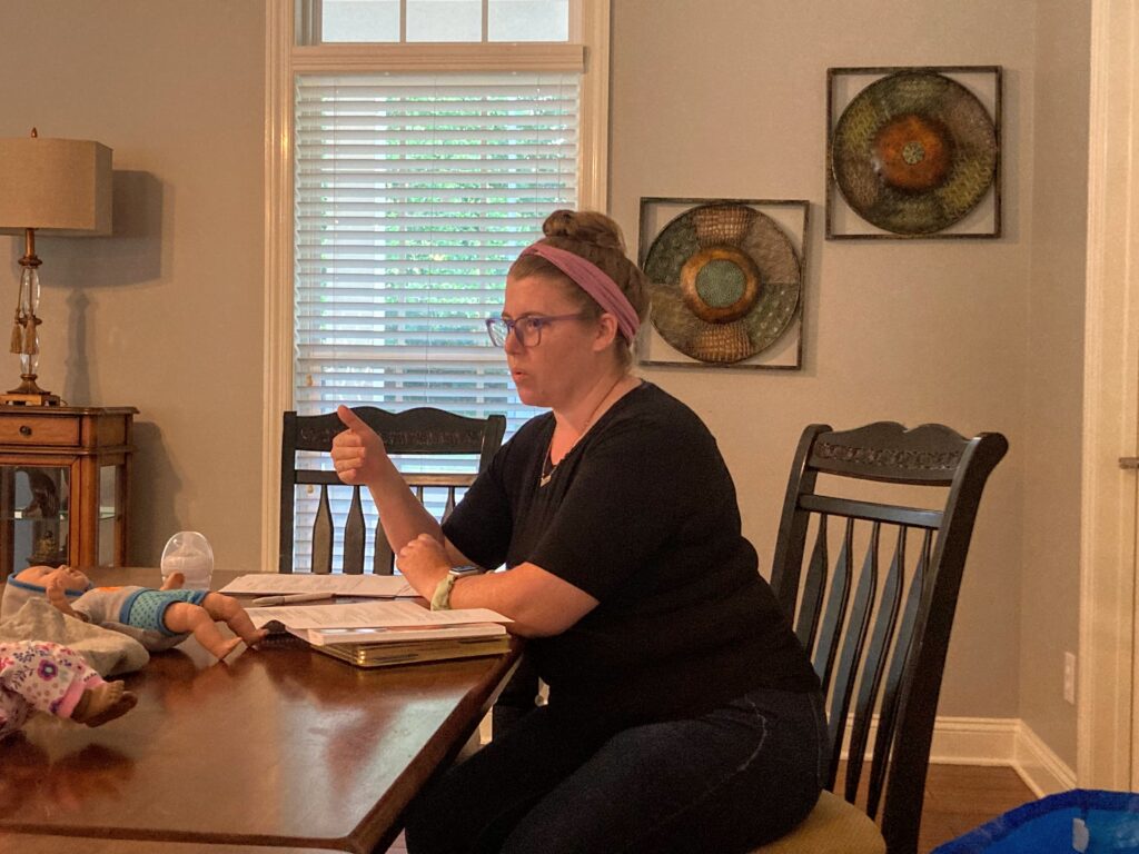 Arin teaching a private newborn care class 